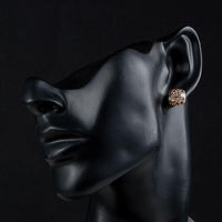 Side angle view of KHAISTA crystal stars stud earrings