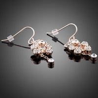 Close up of KHAISTA crystal teddy bear earrings