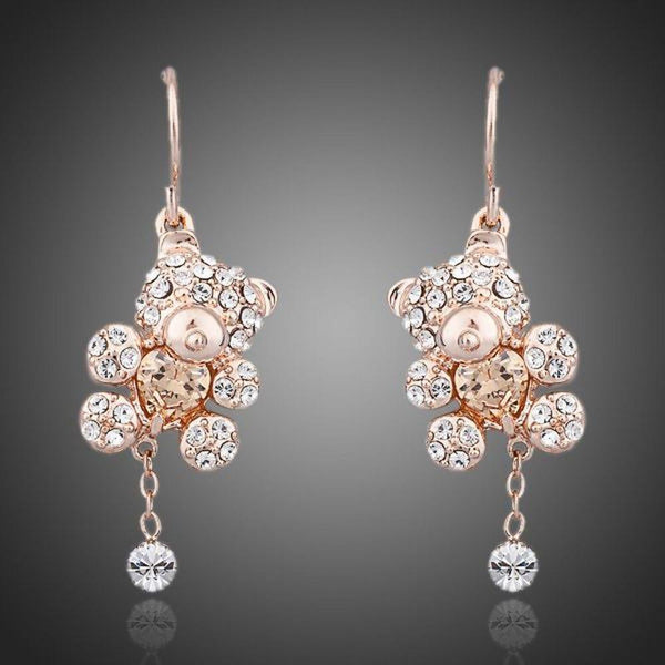 KHAISTA crystal teddy bear earrings on white background