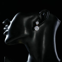 Side angle view of KHAISTA white CZ crystal drop earrings