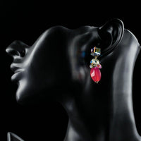 Close up of KHAISTA cube Stellux Austrian crystal drop earrings