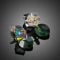 Close up of KHAISTA cube green leaf crystal drop earrings