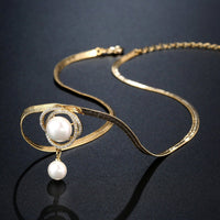 Side angle view of KHAISTA cubic zircon pearl flower necklace