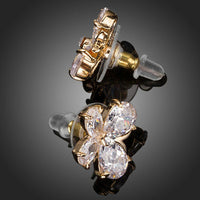 Side angle view of KHAISTA CZ butterfly stud earrings