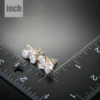 CZ butterfly stud earrings detail view by KHAISTA