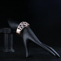 Side angle view of KHAISTA cubic zirconia cuff bangle