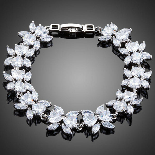 KHAISTA CZ flower garland bracelet on white background