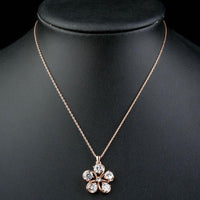 Close up detail of KHAISTA CZ flower pendant necklace