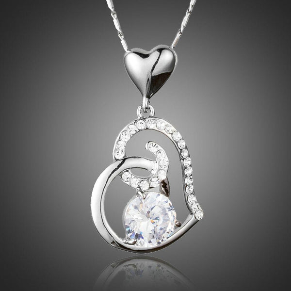 KHAISTA CZ heart pendant necklace on white background