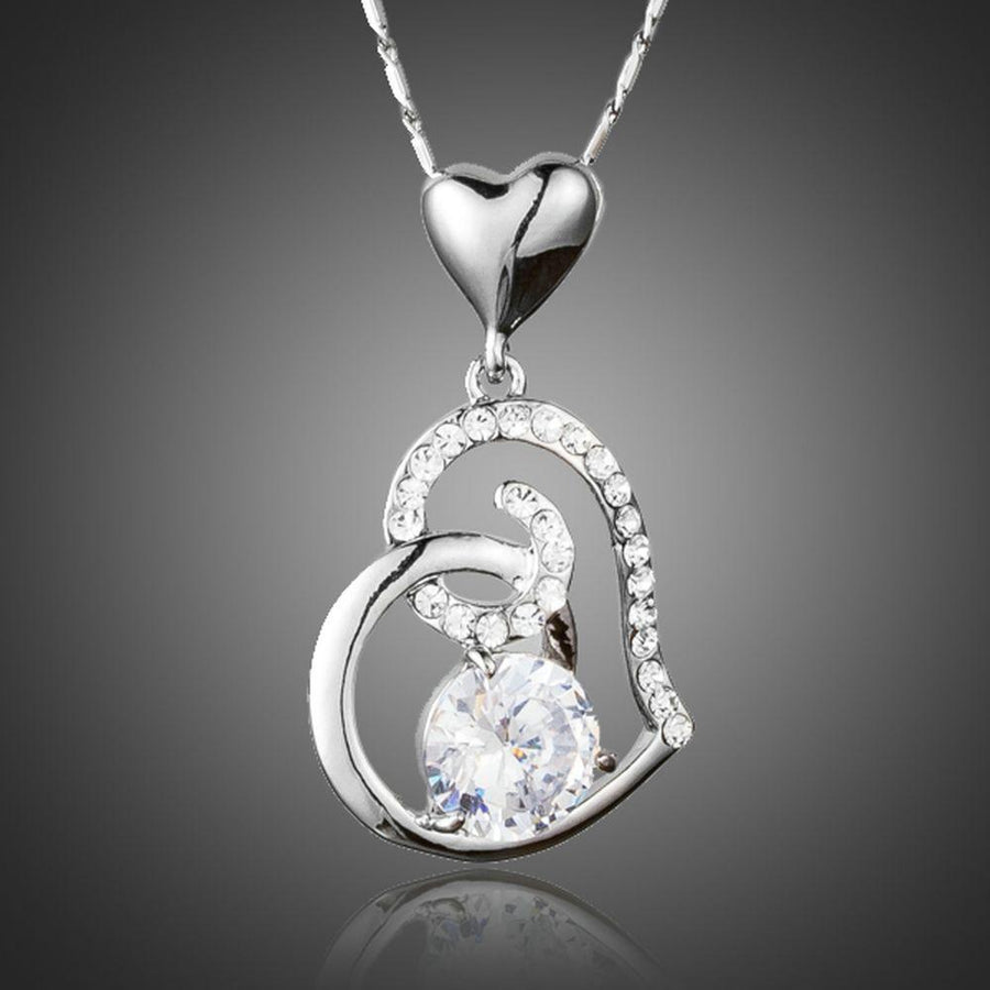 KHAISTA CZ heart pendant necklace on white background
