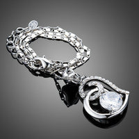 Side angle view of KHAISTA CZ heart pendant necklace