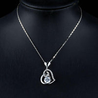 Close up detail of KHAISTA CZ heart pendant necklace
