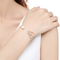 Close up detail of KHAISTA cubic zirconia pearl bangle