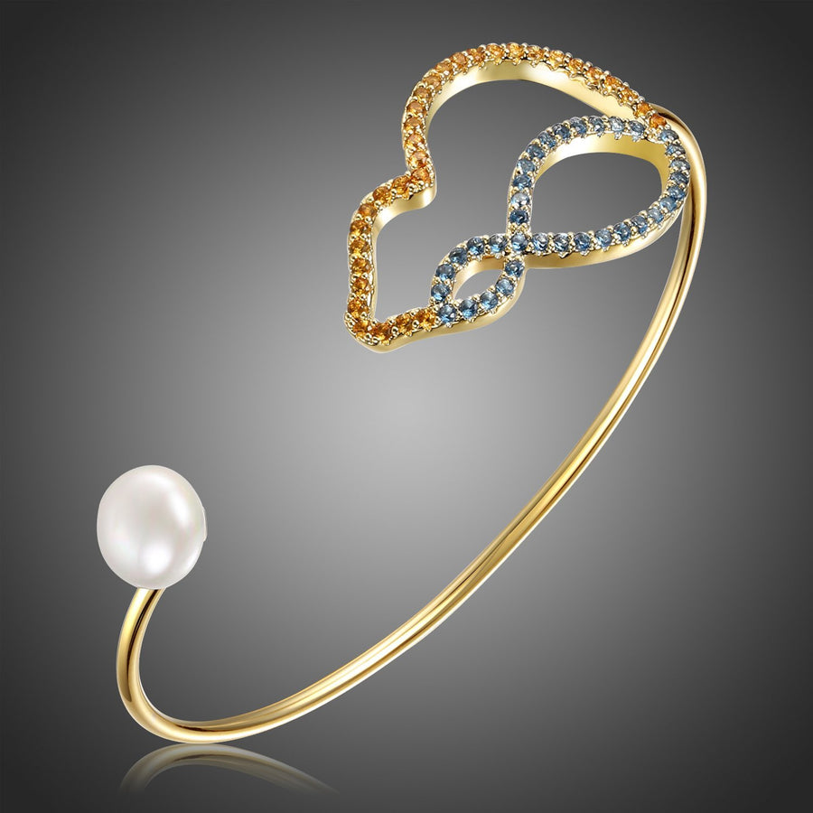 KHAISTA cubic zirconia pearl bangle on white background