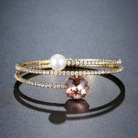 Close up detail of KHAISTA cubic zirconia pearl chain bracelet