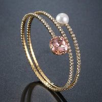 Side angle view of KHAISTA cubic zirconia pearl chain bracelet