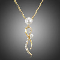 Close up detail of KHAISTA cubic zirconia pearl pendant necklace