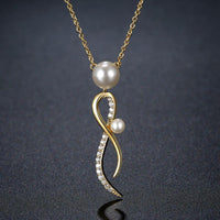 Pendant detail on KHAISTA cubic zirconia pearl pendant necklace