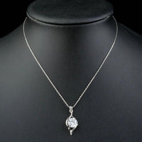 Side angle view of KHAISTA cubic zirconia pendant necklace