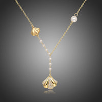 KHAISTA CZ shell long pendant necklace on white background