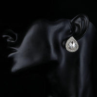 Close up of KHAISTA cubic zirconia stud earrings