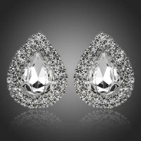 KHAISTA cubic zirconia stud earrings on white background