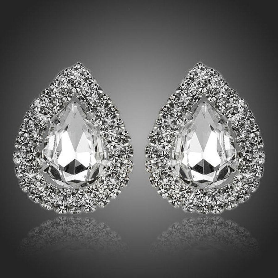 KHAISTA cubic zirconia stud earrings on white background