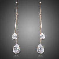 KHAISTA crystal swing drop earrings on white background