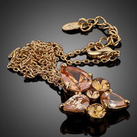 Side angle view of KHAISTA CZ water drop pendant necklace