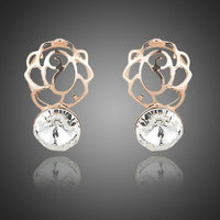 KHAISTA daily wear crystal stud earrings on white background