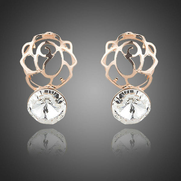KHAISTA daily wear crystal stud earrings on white background