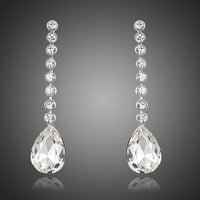 KHAISTA dangling crystal water drop earrings on white background