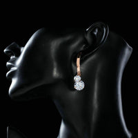 dangling CZ drop earrings detail view by KHAISTA