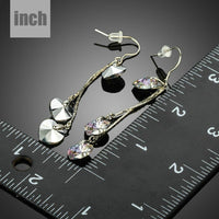dangling heart crystal drop earrings detail view by KHAISTA