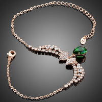 Close up detail of KHAISTA dark green CZ butterfly chain bracelet