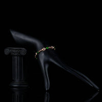 Side angle view of KHAISTA dark green CZ link bracelet