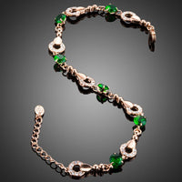Close up detail of KHAISTA dark green CZ link bracelet