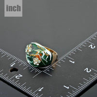 Artistic craftsmanship and structured profiles of the elegant dark green statement ring