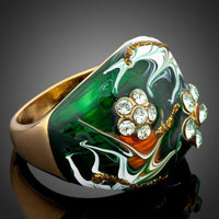Detailed macro close up view of the brilliant stone settings on this premium dark green statement ring