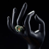 Side angle view highlighting the comfortable band silhouette of the luxury dark green statement ring