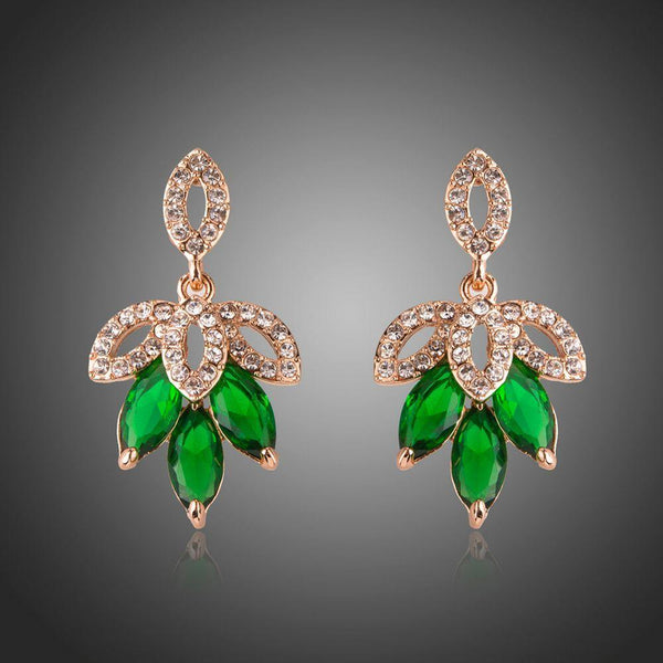 KHAISTA dark green leaves design drop earrings on white background