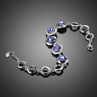 Close up detail of KHAISTA dark blue crystal chain bracelet