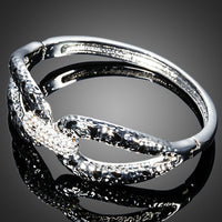 Close up detail of KHAISTA designer crystal cuff bangle