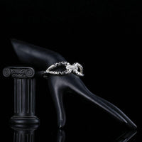 Side angle view of KHAISTA designer crystal cuff bangle