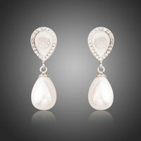 KHAISTA designer pearl drop earrings on white background