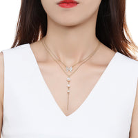 Side angle view of KHAISTA double chain CZ pearl pendant necklace