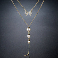 Close up detail of KHAISTA double chain CZ pearl pendant necklace