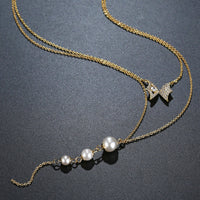 Pendant detail on KHAISTA double chain CZ pearl pendant necklace