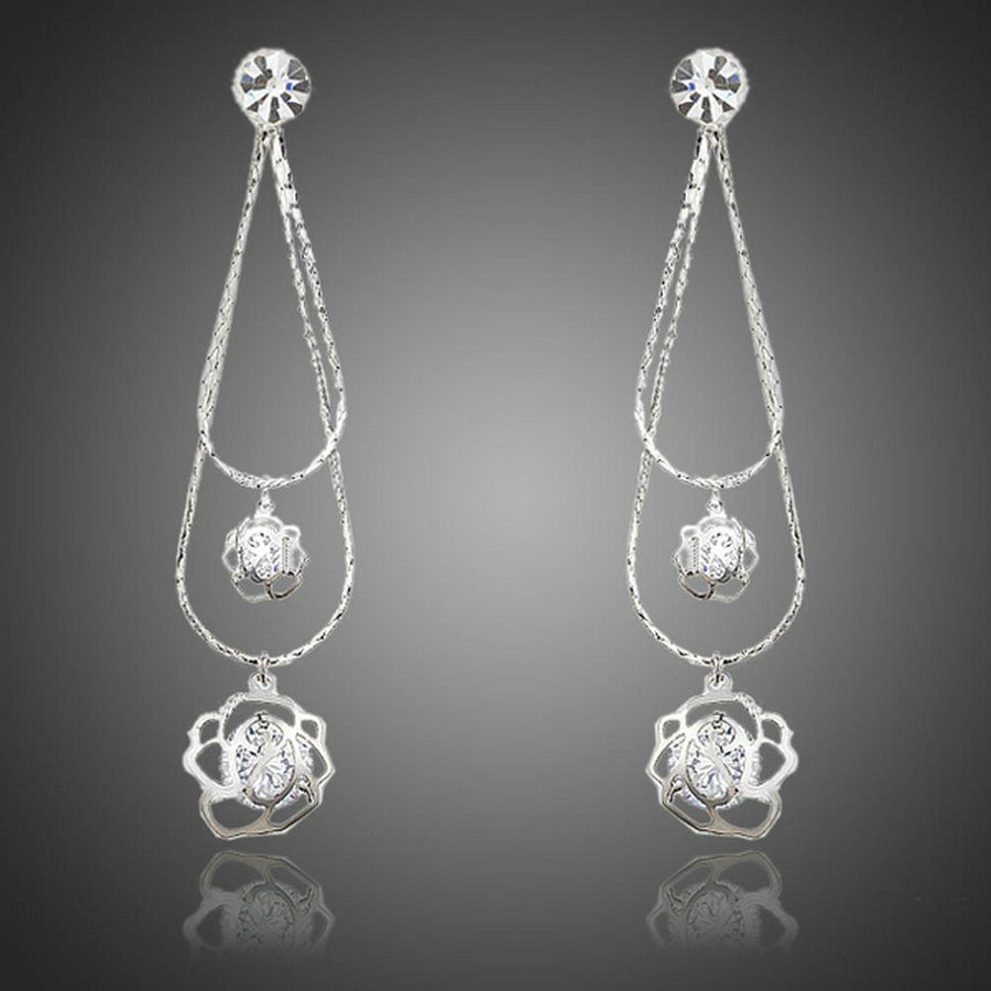 KHAISTA double flower crystal drop earrings on white background