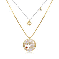 Close up detail of KHAISTA double heart forever love gold CZ necklace